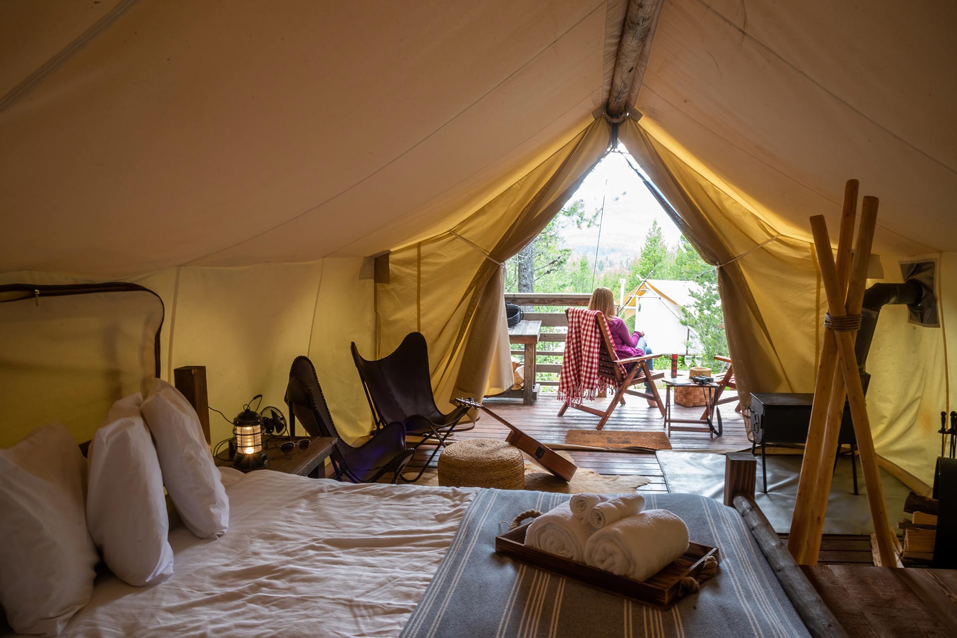 relaxing-outside-luxury-tent-on-glamping-trip-at-g-HLQM9DT